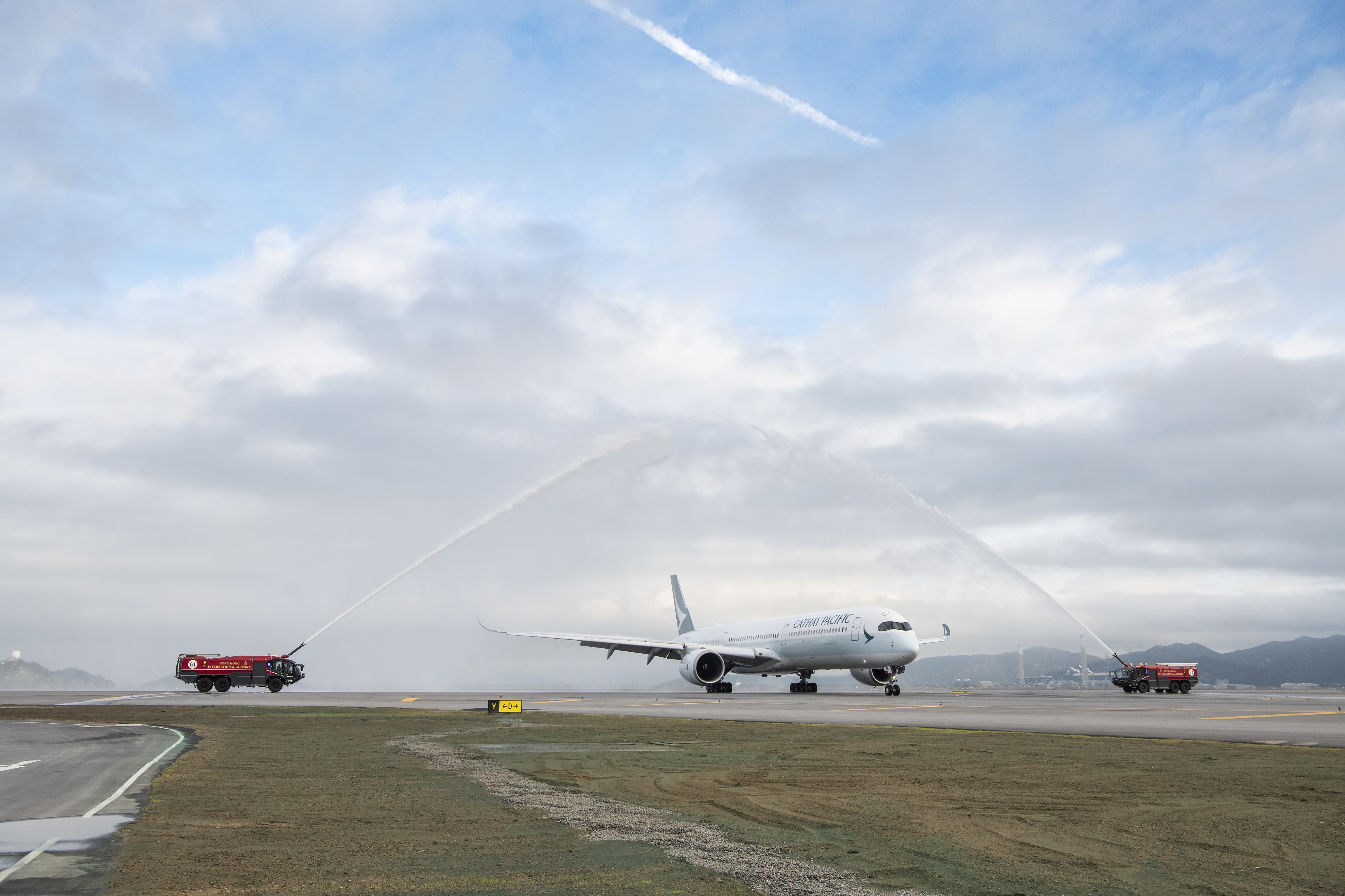 A water salute of the first arrival flight is conducted to mark the official commissioning of the Third Runway.